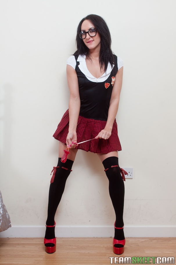 Brunette in red checkered-skirt uniform and red undies loves clear pink dildo on bed - XXXonXXX - Pic 1