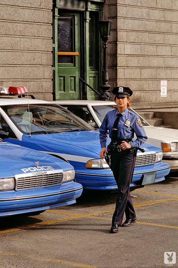 Naughty police officer plays around with her police stick between juicy breasts - XXXonXXX - Pic 1