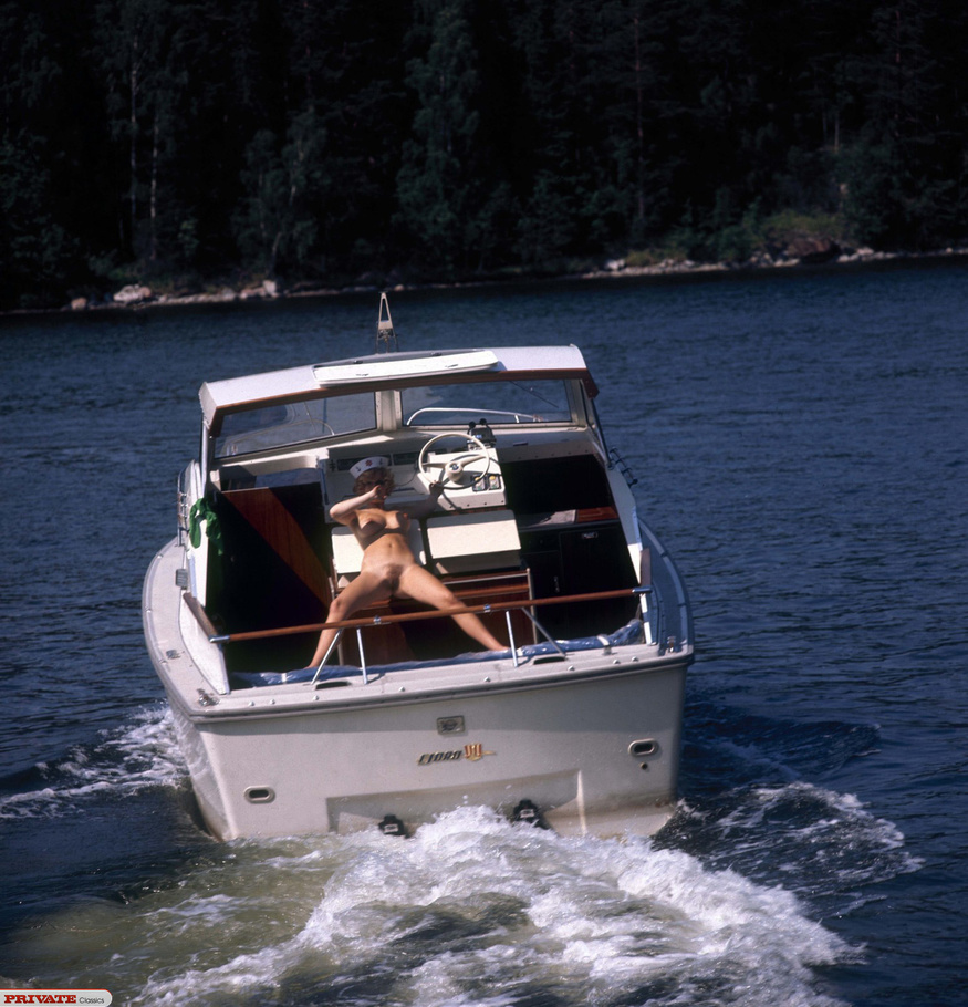 Curly blonde babe pose her foxy body before she takes off her blue dress and expose her lusty boobs and sweet pussy on a speed boat. - XXXonXXX - Pic 2