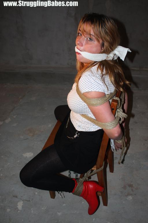 Busty brunette in white top and black pants roped tight to chair and gagged - XXXonXXX - Pic 8