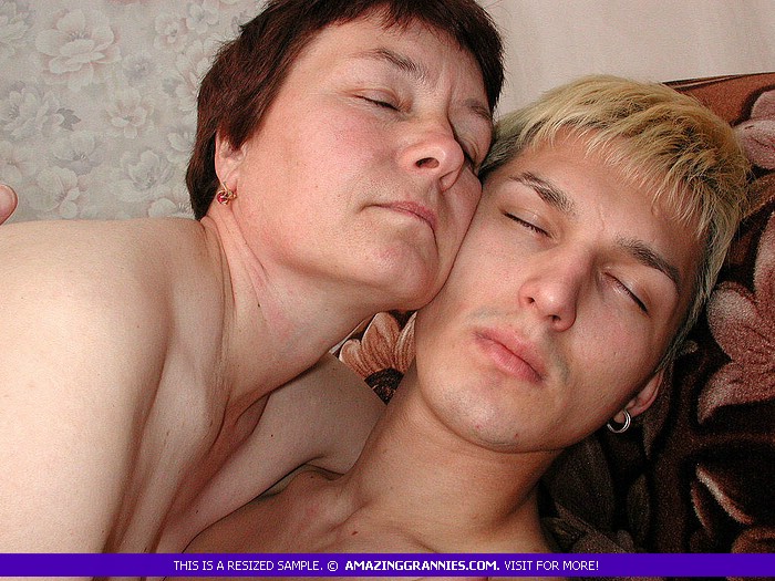 Naked granny with lusty boobs and fat body lets a teen blonde fuck her in different styles til he cums in her mouth on a brown couch. - XXXonXXX - Pic 5