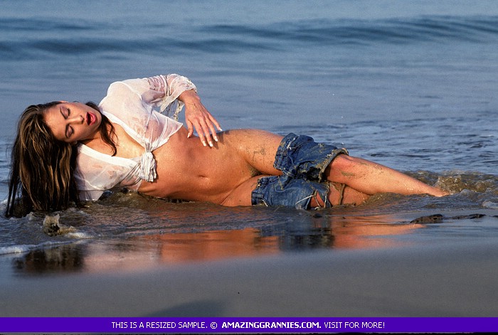 Steaming hot MILF gets her luscious body wet at the beach wearing her white blouse and jeans skirt  before she expose her sweet boobs and juicy pussy. - XXXonXXX - Pic 1