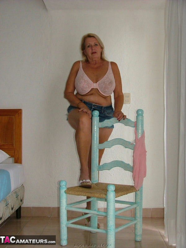 Naughty blonde cougar takes off her top to expose her large bazookas - XXXonXXX - Pic 7