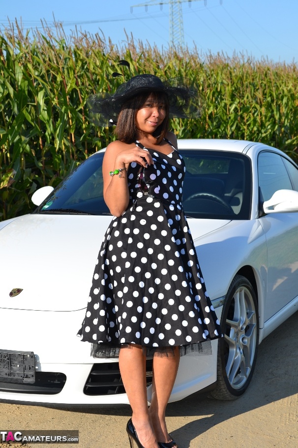 Hot Asian babe poses by an expensive car and strips all of her clothes - XXXonXXX - Pic 2