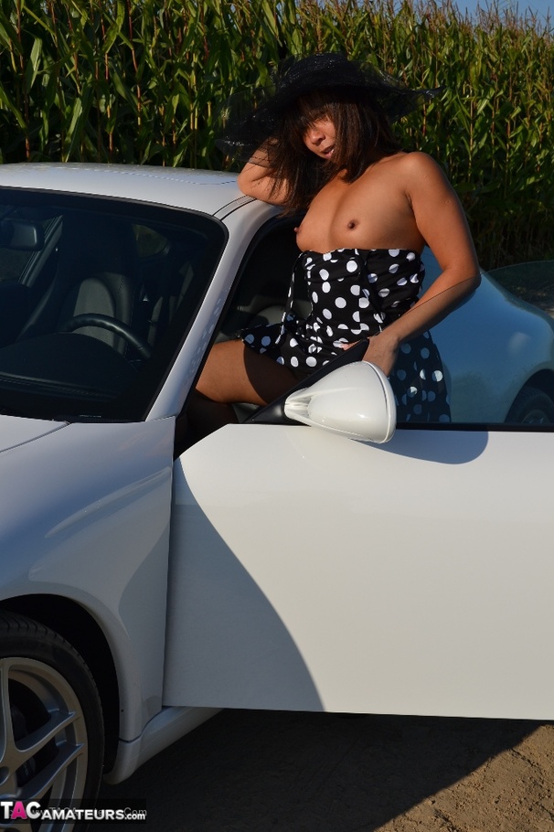 Hot Asian babe poses by an expensive car and strips all of her clothes - XXXonXXX - Pic 8