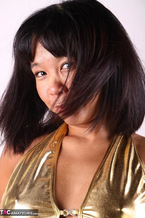Tanned Asian slut poses rather seductively, while wearing sexy golden underwear - XXXonXXX - Pic 3
