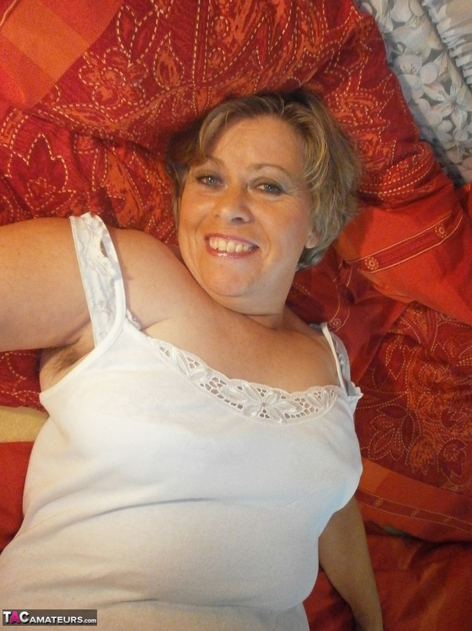 Blonde mature bimbo poses wearing nothing but a pair of sexy white stockings - XXXonXXX - Pic 6