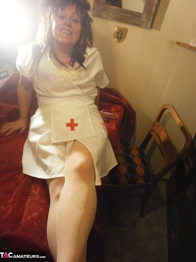 Naughty mature nurse touches her big boobs and shows her fanni to the cam - XXXonXXX - Pic 1