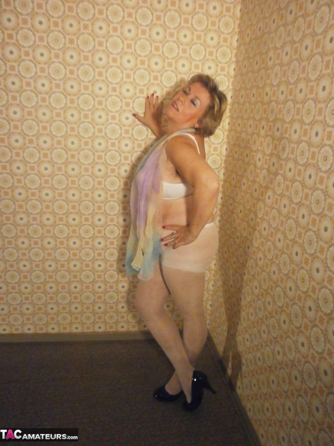 Fat-ass blonde cougar teases with her legs and feet, while in sexy nylon stockings - XXXonXXX - Pic 13