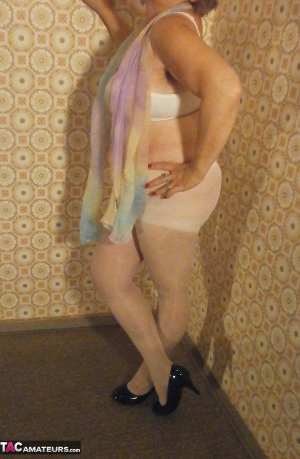 Fat-ass blonde cougar teases with her legs and feet, while in sexy nylon stockings - XXXonXXX - Pic 14