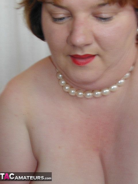 Fat slut is wearing sexy stockings while teasing with her big tits and round ass - XXXonXXX - Pic 13
