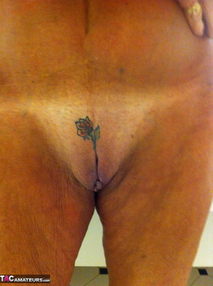 This tattooed slut, with short hair, shows off her wrinkly body - XXXonXXX - Pic 14