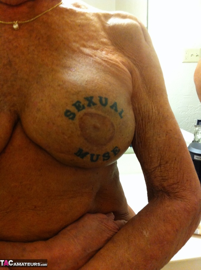 This tattooed slut, with short hair, shows off her wrinkly body - XXXonXXX - Pic 15
