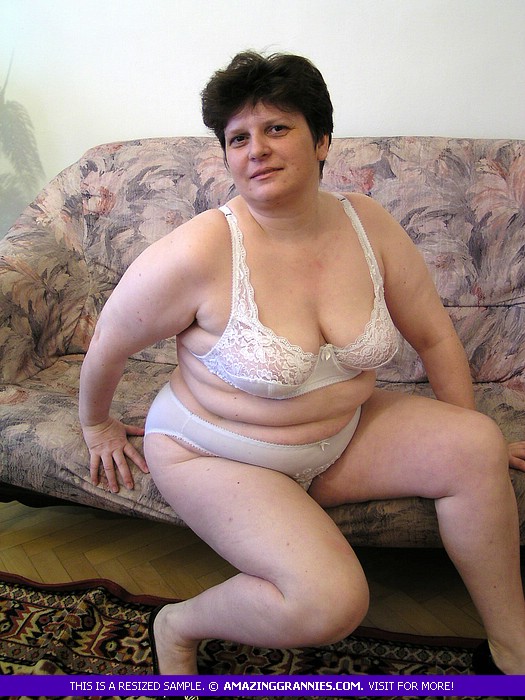Fat granny displays her enormous body in white underwear and black high heels on a pink and purple couch before she takes off her bra and expose her large tits then pulls down her panty and bares her hairy crack in different poses. - XXXonXXX - Pic 2