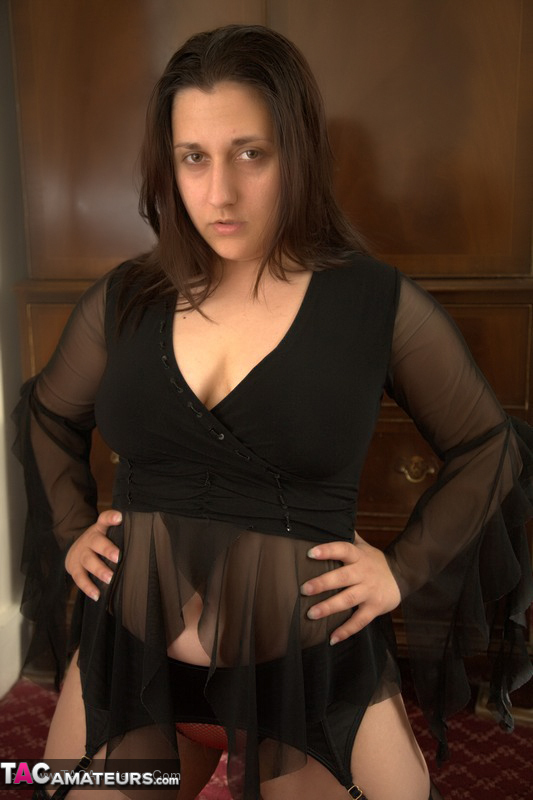 Hot MILF displays her chubby body in different poses wearing her black lingerie, stockings and orange and clear high heels in different parts of the house. - XXXonXXX - Pic 7