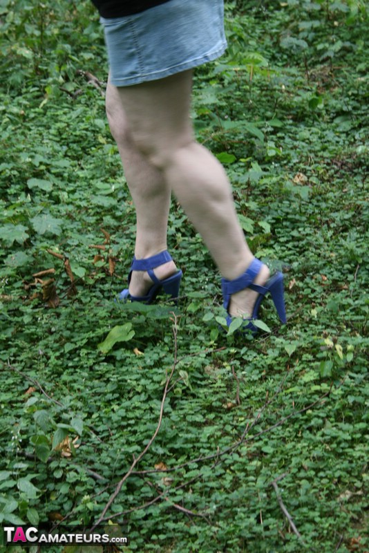 Mature BBW displays her plus size body in black shirt, jeans skirt and blue high heels then shows her extra large boobs in the woods. - XXXonXXX - Pic 5