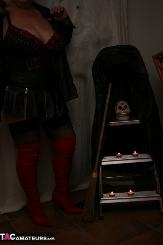 Hot granny takes off her black jacket and teases with her monster tits and chubby body in red and black lingerie, black skirt, stockings and red boots. - XXXonXXX - Pic 9