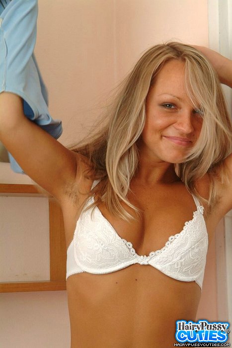 High heeled blonde in pink skirt and white undies strips by the wall before exposing her big tits and hairy fuck hole on the floor - XXXonXXX - Pic 2
