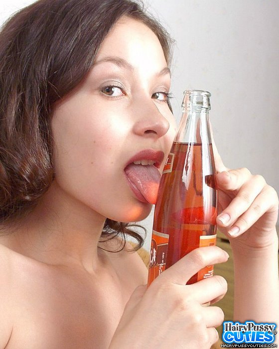 Small tits brunette in white undies playing with bottle and drinking soda before riding bottle on the table - XXXonXXX - Pic 1