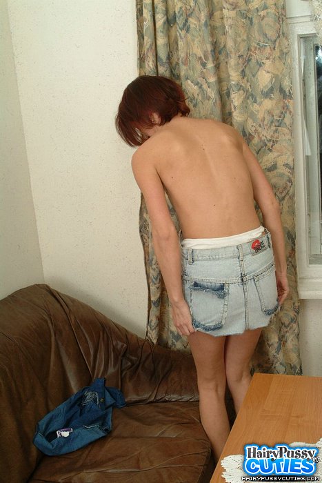 Green eyed redhead in jeans clothes and white underwear strips on the brown couch and exposes her bushy cunt - XXXonXXX - Pic 4