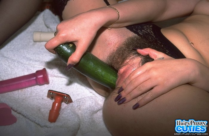 Busty brunette in black stockings spreading on the floor and using different dildos and cucumber to toy her hairy fuck holes - XXXonXXX - Pic 9