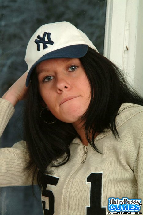 Black haired bimbo in red lingerie and pink outfit stripteasing and showing her hairy cunt on the window sill - XXXonXXX - Pic 1