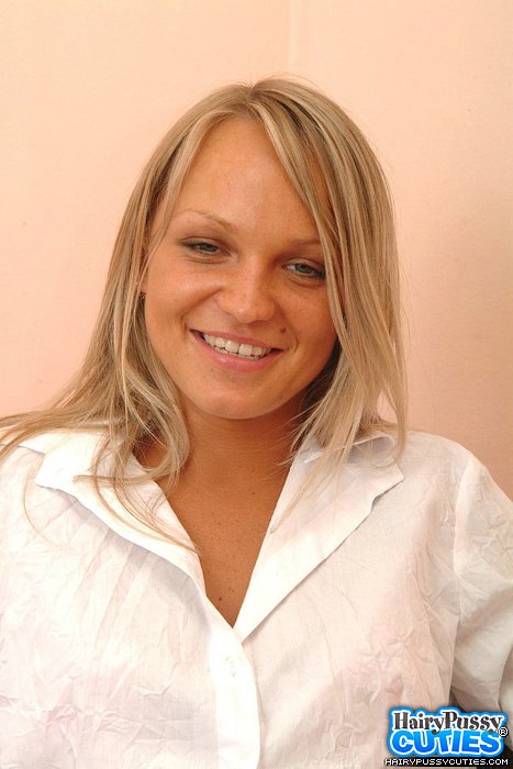 Big boobied blonde in jeans miniskirt and pink lingerie stripteasing on the red chair just to show her bushy snatch - XXXonXXX - Pic 1
