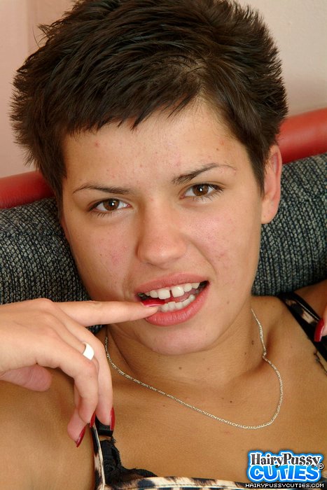 Brown eyed brunette in seethrough panty and black bra strips on the red chair and rubs her hairy cunt - XXXonXXX - Pic 1