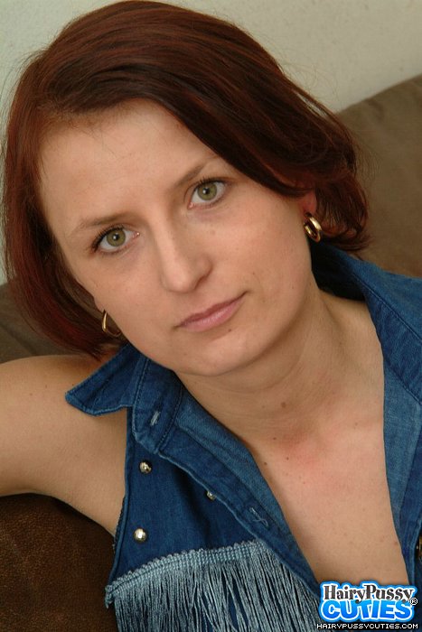 Redhead milf in jeans outfit and white underwear got nude and exposing her hairy snatch on the leather couch - XXXonXXX - Pic 1