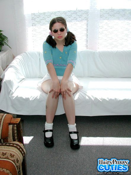 Pigtailed brunette in sunglasses took of white miniskirt and blue top just to expose her hairy snatch by the white couch - XXXonXXX - Pic 10