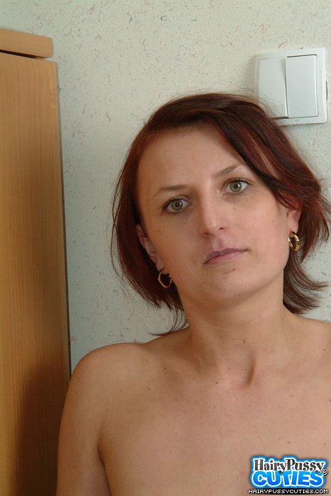 Redhead brunette in colorful clothes and white undies posing and undressing by the commode before exposing her bushy snatch - XXXonXXX - Pic 3