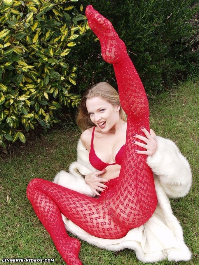 Alluring babe pose her stunning body outdoor wearing her white furry coat, red bra and glass high heels before she pulls down her red pantyhose and bares her indulging pussy on the grass. - XXXonXXX - Pic 6