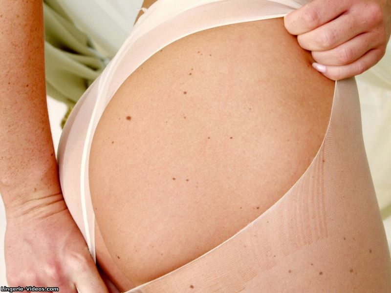 Lusty boobs takes off her green tube dress and reveals her sweet boobs and foxy body before she rips her white stockings and nails her crack with a silver dildo on a green bed. - XXXonXXX - Pic 12