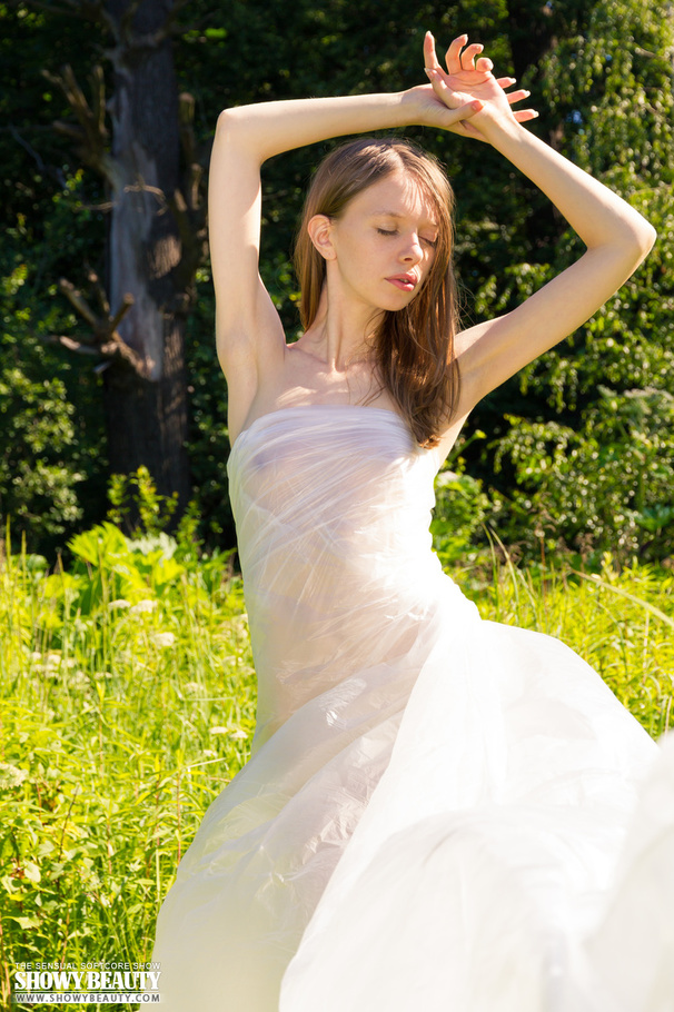 Steaming hot babe peels off her multi colored floral dress and reveals her small boobs and lusty twat in different poses in a grass field. - XXXonXXX - Pic 12