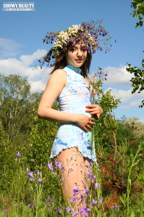 Alluring hottie shows her juicy boobs in different poses on a grass field as she pose her alluring body before she strips down her blue and white panty and reveals her indulging pussy wearing her blue and white blouse. - XXXonXXX - Pic 1