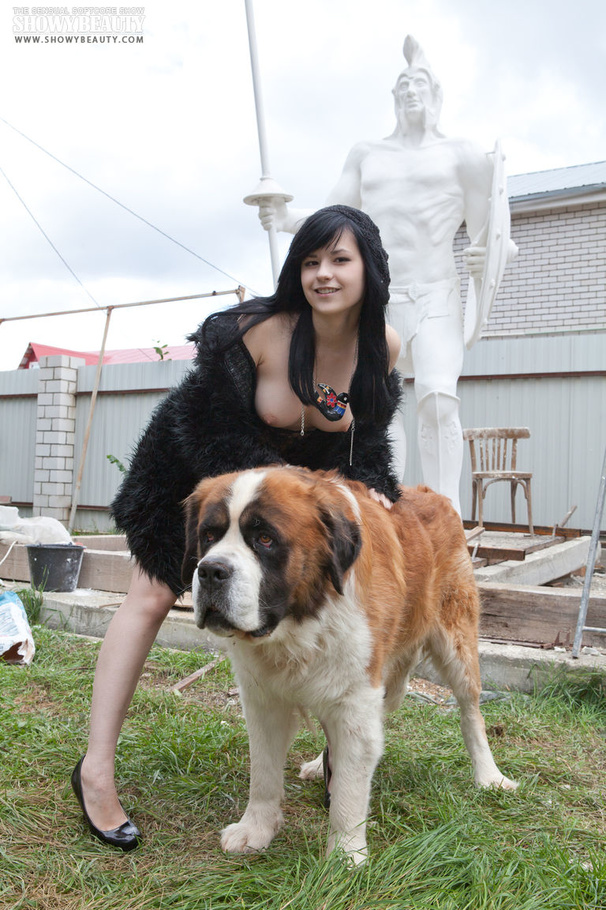 Gorgeous babe wearing black fur coat, blouse, gray and black panty and black high heels shows her luscious boobs while she displays her banging body before she gets naked and reveals her juicy twat in different poses outdoor with her st. bernard. - XXXonXXX - Pic 14