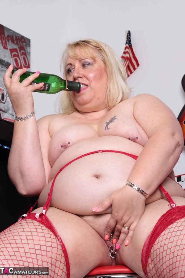 High heeled bbw in red stockings taking off white dress and posing naked by the bar stand - XXXonXXX - Pic 5