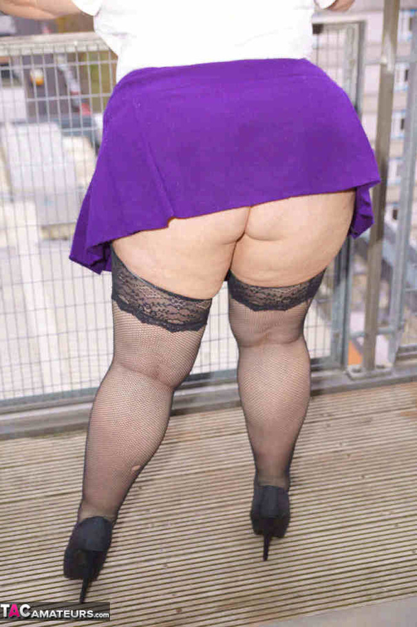 Bbw Black Stockings - High heeled bbw in black stockings and purple miniskirt sheds blue bra and  exposing her pierced snatch on the balcony. Lexie Cummings. Picture 4.