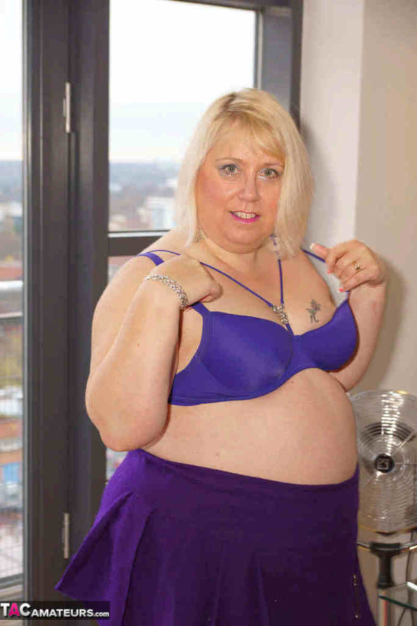 High heeled bbw in black stockings and purple miniskirt sheds blue bra and exposing her pierced snatch on the balcony - XXXonXXX - Pic 17