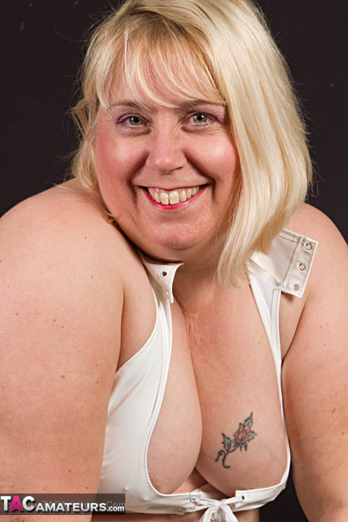 Big blonde in red heels and white stockings flashing her pierced twat under white dress - XXXonXXX - Pic 10