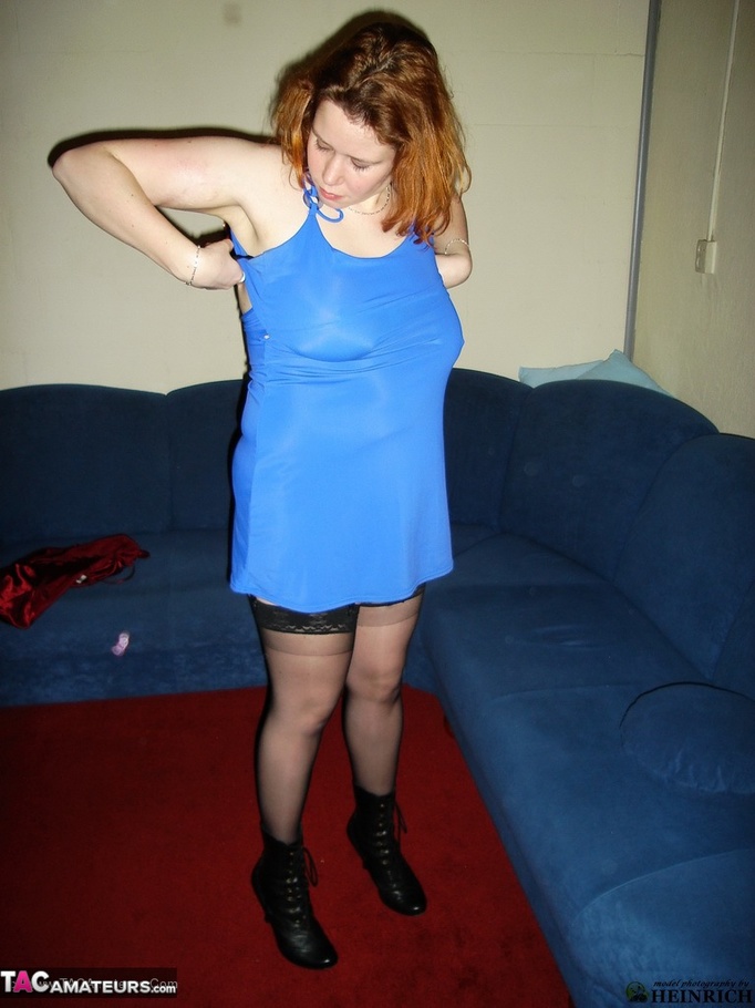 Busty redhead in black stockings and blue dress getting nude and posing naked on the red carpet - XXXonXXX - Pic 1