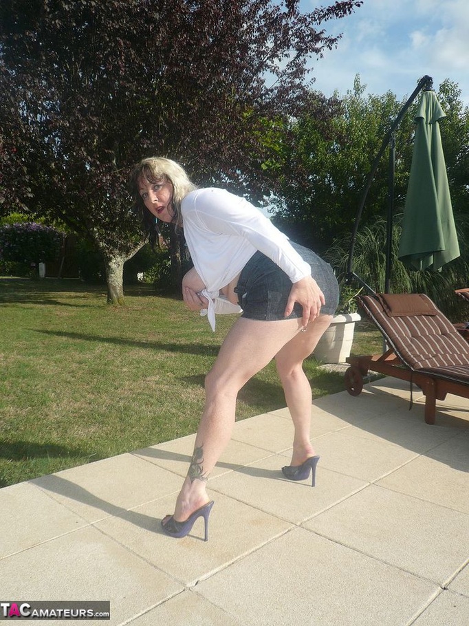 High heeled mom in white top and grey miniskirt teasing outdoors and showing her pierced vagina - XXXonXXX - Pic 4