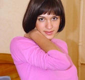 Teen sucks on a dildo and slides it in her pussy