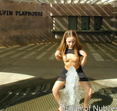 Gorgeous teen plays in the water on a hot day