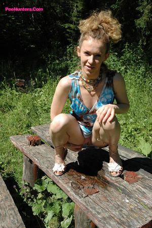 See hot teeny pissing onto her dadâ€™s picnic table - Picture 12