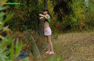 Little babe takes a leak in the nearby bushes - Picture 1