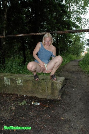 Nasty blonde teeny pissing in a quiet park - Picture 8