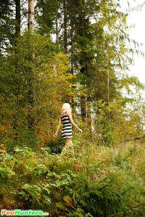 Young blonde with a lot of tattoos pisses in woods - Picture 16