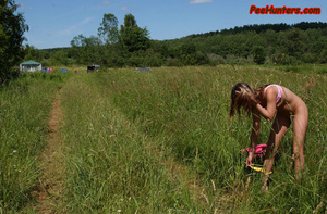 Beautiful teen peeing on the field - Picture 8
