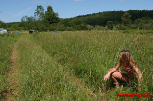 Beautiful teen peeing on the field - Picture 12